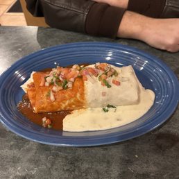 Burrito loco. Steak chicken and shrimp With cheese ranchero sauce in it!! Burrito loco. Steak chicken and shrimp With cheese ranchero sauce in it!!