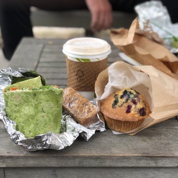 The Green - a muffin, a muffin, and a cup of coffee on a picnic table - Bagels Near Me - Nantucket, Massachusetts The Green - a muffin, a muffin, and a cup of coffee on a picnic table - Bagels Near Me - Nantucket, Massachusetts