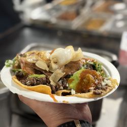 Tacos El Sapo - Tacos de cabeza with green and red salsa, grilled onions, cilantro and onions to taste.