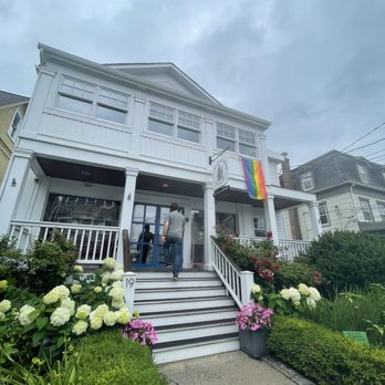 Katonah Reading Room - Entrance to the building with summer flowers and rainbow flag. - Cafes Near Me - Katonah, New York Katonah Reading Room - Entrance to the building with summer flowers and rainbow flag. - Cafes Near Me - Katonah, New York