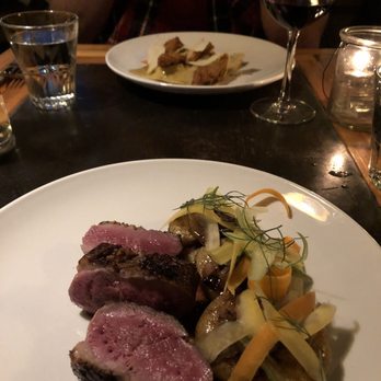 a mano - Foreground: duck breast, background: ravioli. - Italian Near Me - Atlanta, Georgia a mano - Foreground: duck breast, background: ravioli. - Italian Near Me - Atlanta, Georgia