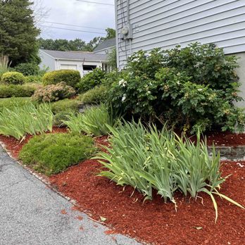 TJ's Landscaping & Property Maintenance - the front of a house with a flower bed in the foreground - Landscaping Near Me - Methuen, Massachusetts