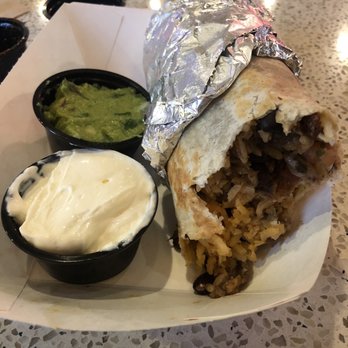 Dos Chamucos Taqueria - Al Pastor burrito. Side o guac and sour cream. Whoops took a bite before taking a pic. Hope that doesn't gross you out. - Mexican Near Me - Seattle, Washington Dos Chamucos Taqueria - Al Pastor burrito. Side o guac and sour cream. Whoops took a bite before taking a pic. Hope that doesn't gross you out. - Mexican Near Me - Seattle, Washington