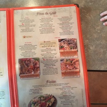 El Tapatio - a person holding a menu - Mexican Near Me - Cape Girardeau, Missouri