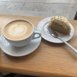 Oat milk latte and a slice of tahini cake (both amazing) Oat milk latte and a slice of tahini cake (both amazing)
