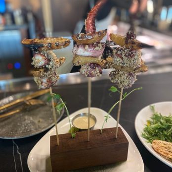 Moon's Daughter - Thompson San Antonio - Char grilled octopus skewers - Mediterranean Near Me - San Antonio, Texas Moon's Daughter - Thompson San Antonio - Char grilled octopus skewers - Mediterranean Near Me - San Antonio, Texas
