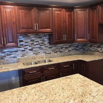 Resil Home Improvement - a kitchen with granite countertops - General Contractors Near Me - Chicago, Illinois