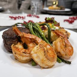 Filet Mignon with shrimp, asparagus, and twice baked potatoes.