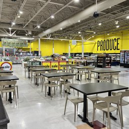 empty tables and chairs in a grocery store empty tables and chairs in a grocery store