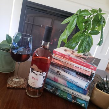 Waterside Vineyard & Winery - a glass of wine and a stack of books - Wineries Near Me - Enderby, British Columbia Waterside Vineyard & Winery - a glass of wine and a stack of books - Wineries Near Me - Enderby, British Columbia