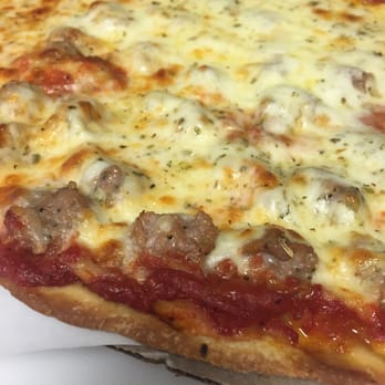 Tortorice's Pizza - Sausage thin crust. I'm not normally a sausage person but this is good. - Pizza Near Me - Chicago, Illinois