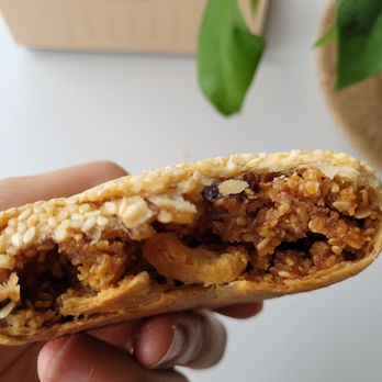 M Y Bakery - a hand holding a burrito - Bakeries Near Me - Milpitas, California