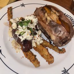Filet mignon with crab on top of fried asparagus and cinnamon butter sweet potato. Filet mignon with crab on top of fried asparagus and cinnamon butter sweet potato.