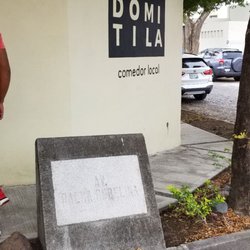 Domitila - Outside of restaurant.