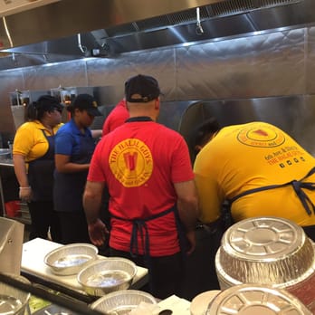 The Halal Guys - 5 employees huddled around a grill, nobody assembling plates, this was the bottleneck - Halal Near Me - Costa Mesa, California