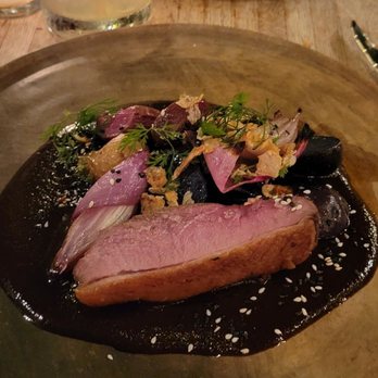 Claro - From afar: Mole Rojo ( pork cheeks) . Close up: Mole Negro (pekin duck) - Mexican Near Me - Brooklyn, New York