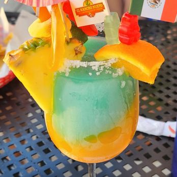 El Rancho Nuevo - a colorful drink in a glass - Mexican Near Me - Mason, Ohio El Rancho Nuevo - a colorful drink in a glass - Mexican Near Me - Mason, Ohio