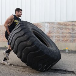 Ultimate Fighting & Fitness Academy - Outdoor Tire workout for Xtreme Fit class
