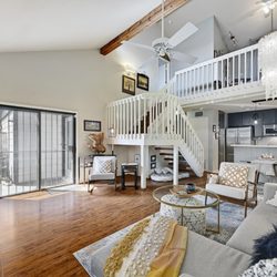 Heather Witte - Witte Group - Vaulted beamed ceilings with 2 living areas