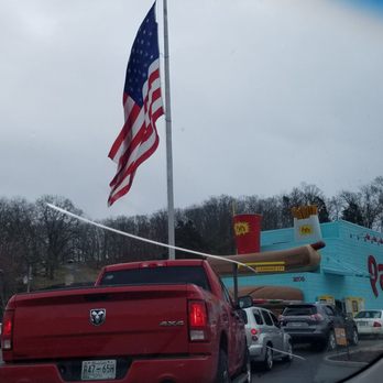Pal's - an american flag flying in the wind - Fast Food Near Me - Johnson City, Tennessee