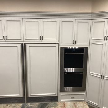 VIBA Construction - a kitchen with white cabinets and stainless steel appliances - General Contractors Near Me VIBA Construction - a kitchen with white cabinets and stainless steel appliances - General Contractors Near Me