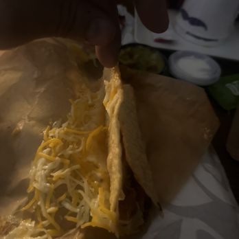 Taco Bell - This is the new Cantina Chicken Crispy Taco Meal. Cheese on the outside of the taco, beaf not chicken, and smashed. Made me feel unsafe too - Fast Food Near Me - Columbus, Ohio