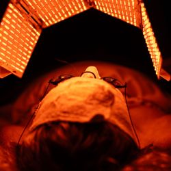 Balance Holistic Health Spa - A client getting a facial with lightstim LED lighting