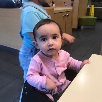 McDonald's - a baby sitting in a high chair - Fast Food Near Me - Calcium, New York