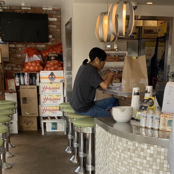 Burger Lounge - a man sitting at a counter - Burgers Near Me - La Jolla, California Burger Lounge - a man sitting at a counter - Burgers Near Me - La Jolla, California