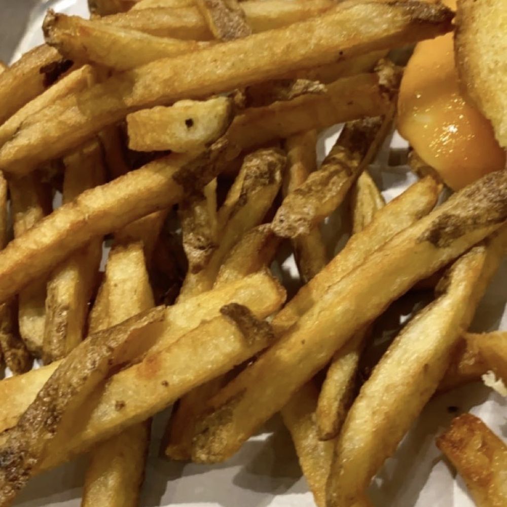 Somehow burnt and limp/ soggy fries.