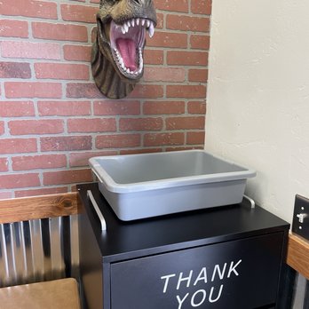 Jurassic Street Tacos - a t - rex head hanging on a brick wall - Food Trucks Near Me - Eagle Mountain, Utah Jurassic Street Tacos - a t - rex head hanging on a brick wall - Food Trucks Near Me - Eagle Mountain, Utah
