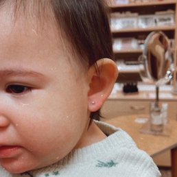 A couple of minutes after my baby girl's ears were pierced. She was such a trooper!