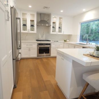 Huma Home Design and Builders - Kitchen Remodel after, Calcatta counters, shaker glass cabinets, custom backsplash counters, luxury vinyl flooring - General Contractors Near Me - Los Angeles, California Huma Home Design and Builders - Kitchen Remodel after, Calcatta counters, shaker glass cabinets, custom backsplash counters, luxury vinyl flooring - General Contractors Near Me - Los Angeles, California