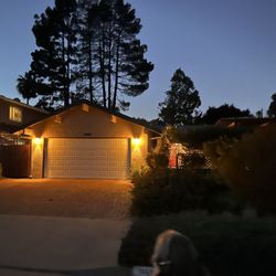 Acropolis - Garage sconces provide warm welcoming glow