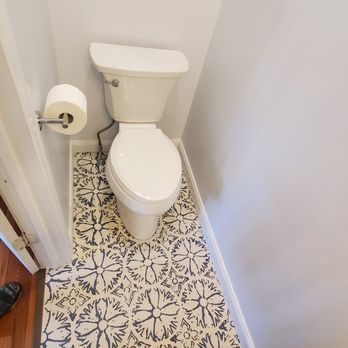Tropea Services - a toilet in a bathroom - General Contractors Near Me
