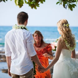 Aloha Weddings in Paradise - Conducting a wedding ceremony at Kukio Beach. [photo: Karen Loudon Photography]