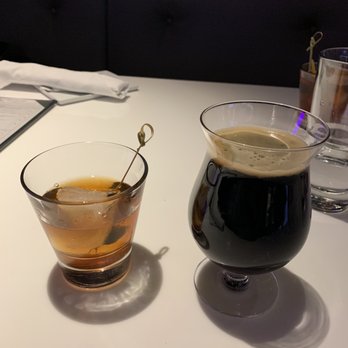 Bol - a glass of beer and a cup of coffee on a table - Bowling Near Me - Vail, Colorado