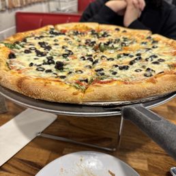 Classic Bronx Pizza with black olives and spinach