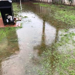 Flooding from the rains in backyard before the drains were installed. Flooding from the rains in backyard before the drains were installed.