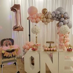 Floating Art Balloon Decor and Designs - *Client preference* Here we have a 1st birthday party setting. Soft baby colors elegantly created into a half organic balloon arch.
