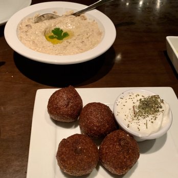 NAYA - Fried beef kibbe (foreground) and baba ghannouj (background) - Mediterranean Near Me - New York, New York NAYA - Fried beef kibbe (foreground) and baba ghannouj (background) - Mediterranean Near Me - New York, New York