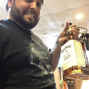 Barbarita's Liquor Store - a man holding a bottle - Beer, Wine & Spirits Near Me - Miami Lakes, Florida Barbarita's Liquor Store - a man holding a bottle - Beer, Wine & Spirits Near Me - Miami Lakes, Florida