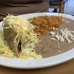 Tiny crunchy taco with plain rice and beans. Tiny crunchy taco with plain rice and beans.