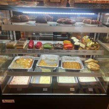 The Yemeni Bean - This is the scary cabinet with the desserts ... All look awesome!! - Coffee & Tea Near Me - Spring, Texas