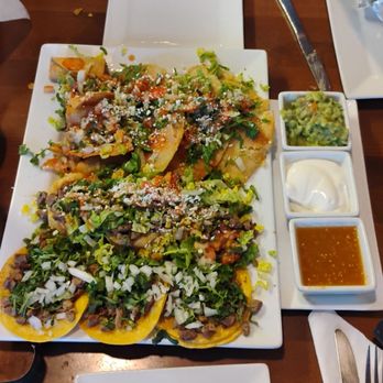 Los Molcajetes Mexican Restaurant - Los molcajetes appetizer plate. 3 tacos 3 sopes 3 quesadillas fritos and taquitos. - Mexican Near Me - Castro Valley, California Los Molcajetes Mexican Restaurant - Los molcajetes appetizer plate. 3 tacos 3 sopes 3 quesadillas fritos and taquitos. - Mexican Near Me - Castro Valley, California