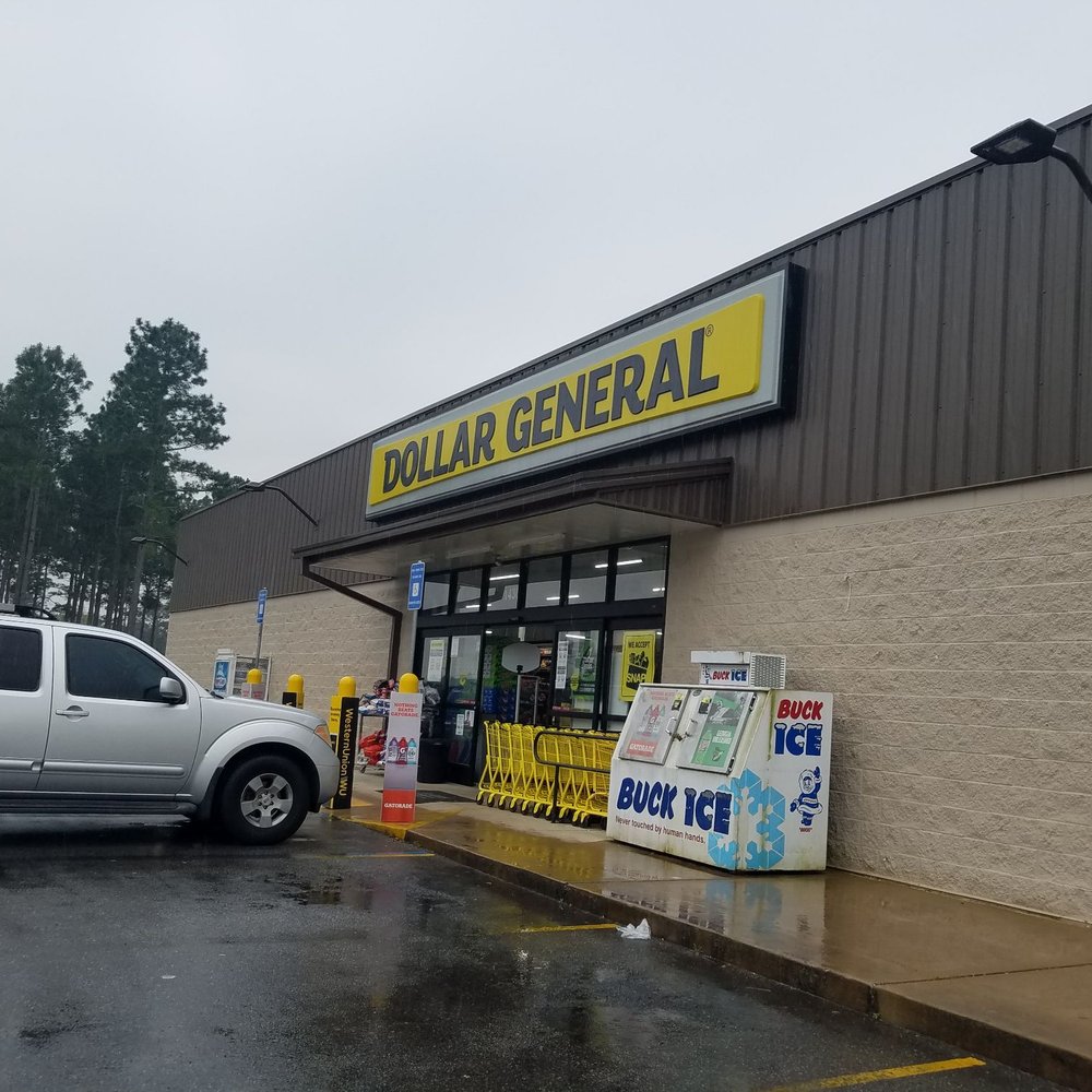 Dollar General - a car parked in front of a dollar general store - Grocery Near Me - Cairo, Georgia