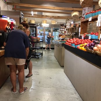 Brecknock Orchard - Slushie machine to the left with fresh grown peach, apple and other home grown fruit slushies. - Fruits & Veggies Near Me - Mohnton, Pennsylvania