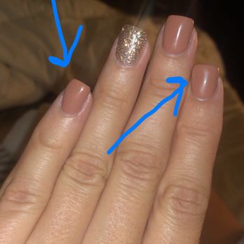 Ellie Nails & Spa - Pinky nail is sloppy due to covering up lumps in polish instead of fixing properly. Uneven and poor shaping - Nail Salons Near Me - Milwaukee, Wisconsin