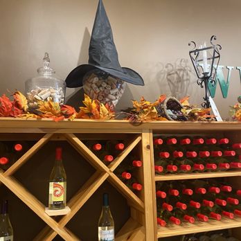 Oz Winery - a shelf of wine bottles and a witch hat - Wine Tasting Room Near Me - Wamego, Kansas Oz Winery - a shelf of wine bottles and a witch hat - Wine Tasting Room Near Me - Wamego, Kansas