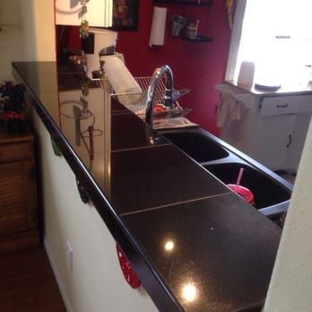 Handy Lance - a kitchen counter with a sink and faucet - Handyman Near Me